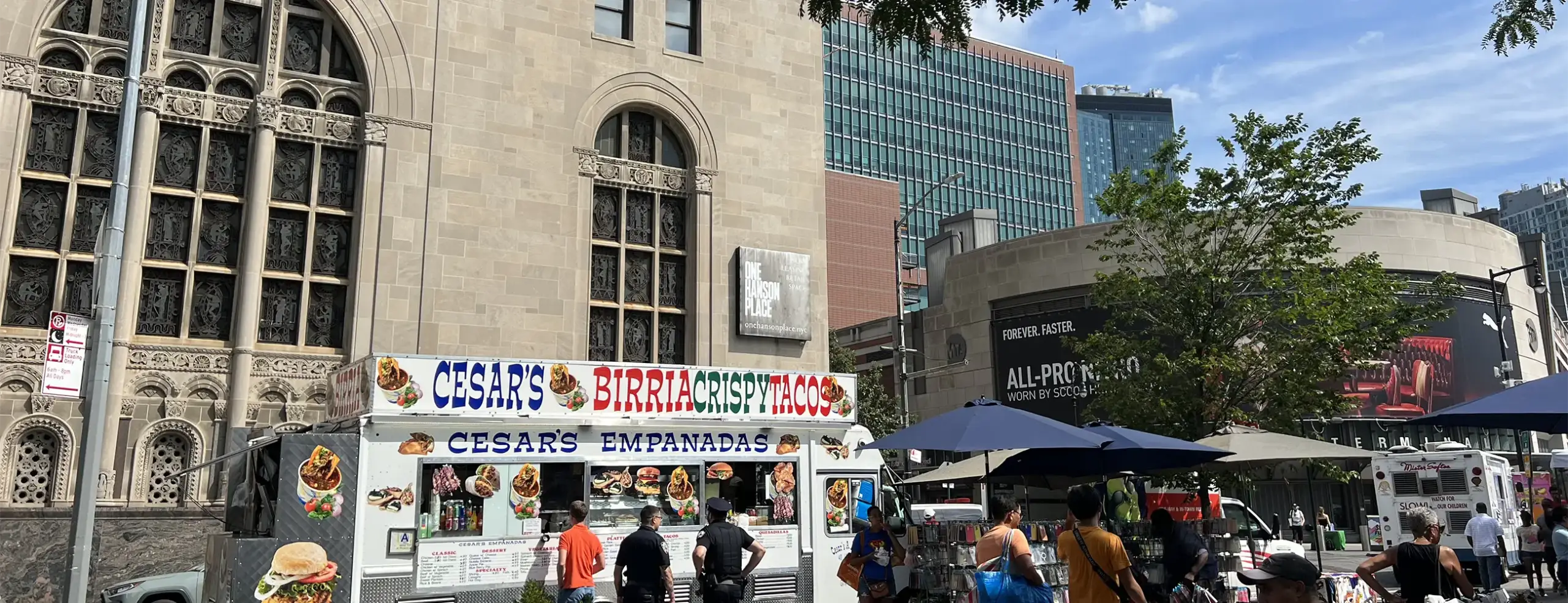 Food truck and people in front of Downtown Brooklyn buildings