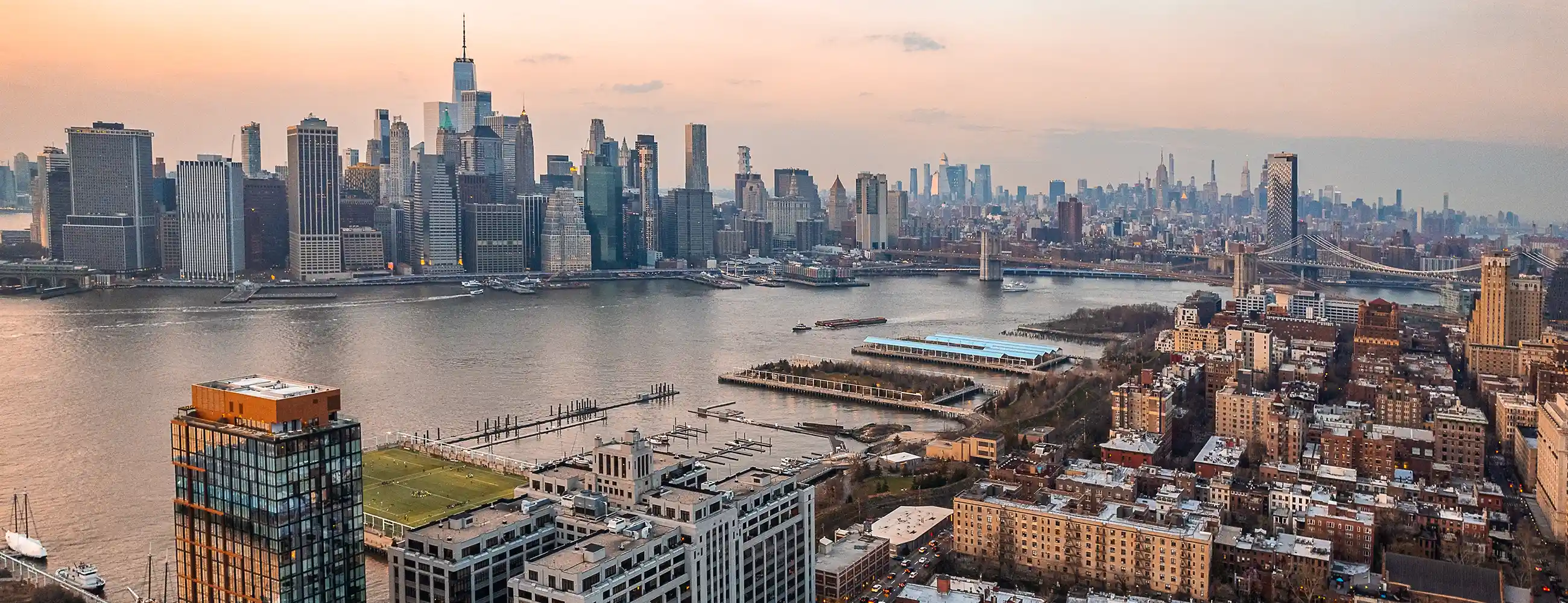 Aerial view of Brooklyn Heights with East River and Manhattan skyline in background