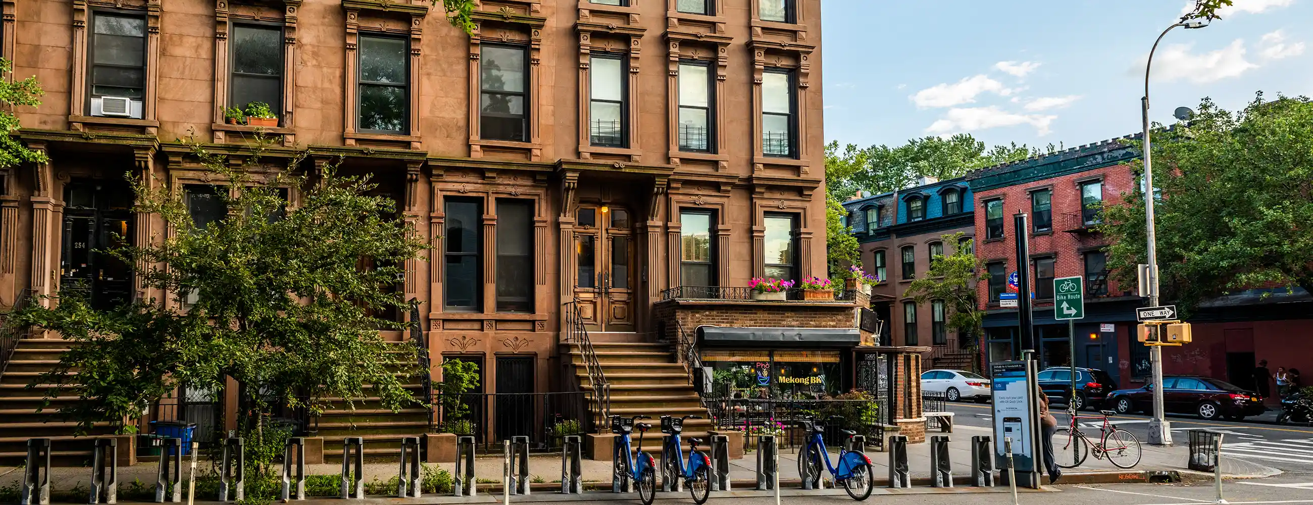 Bike rental rack in front of large brownstone in Clinton Hill, Brooklyn