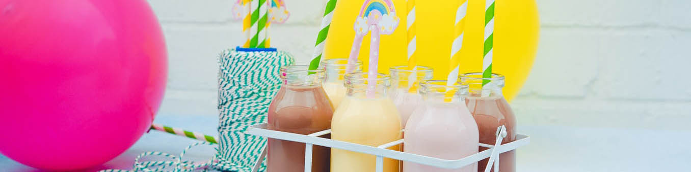 Pink Balloon Beside Crate of Milkshakes