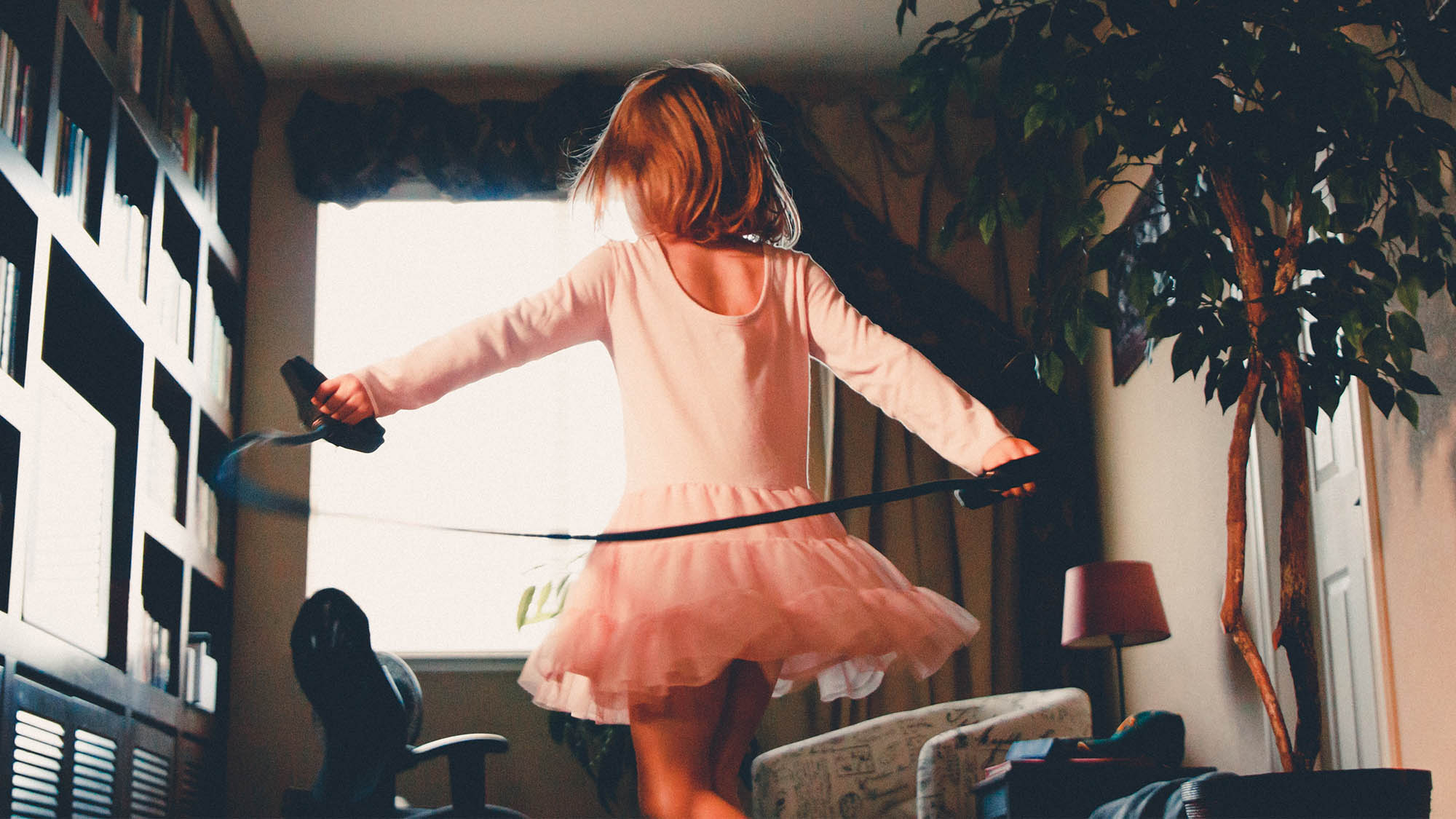 Girl Jumping Rope in Tutu from Behind