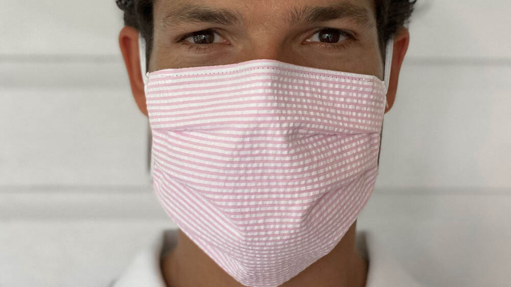 Man Wearing Pink White Seersucker Face Mask