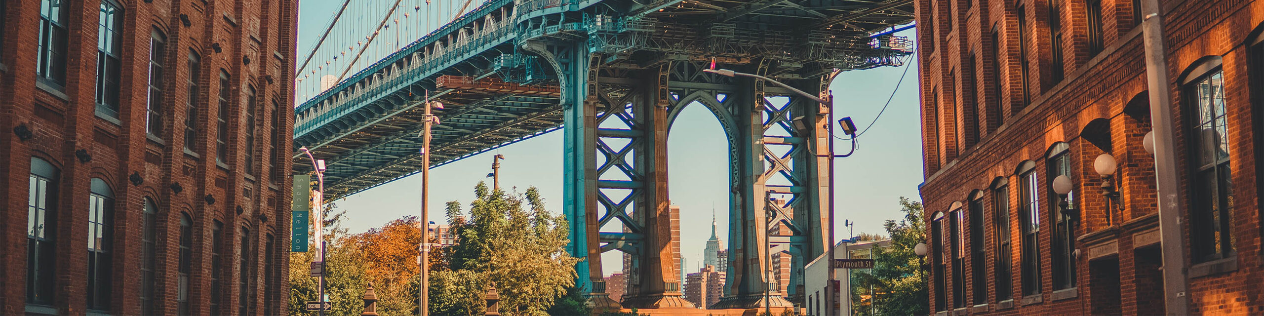 Bottom of Manhattan Bridge Between Two Brooklyn Buildings