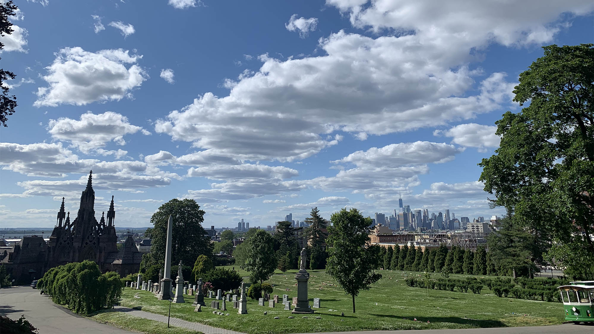 Headstones at Greenwood Cemetery Brooklyn with Manhattan skyline in background