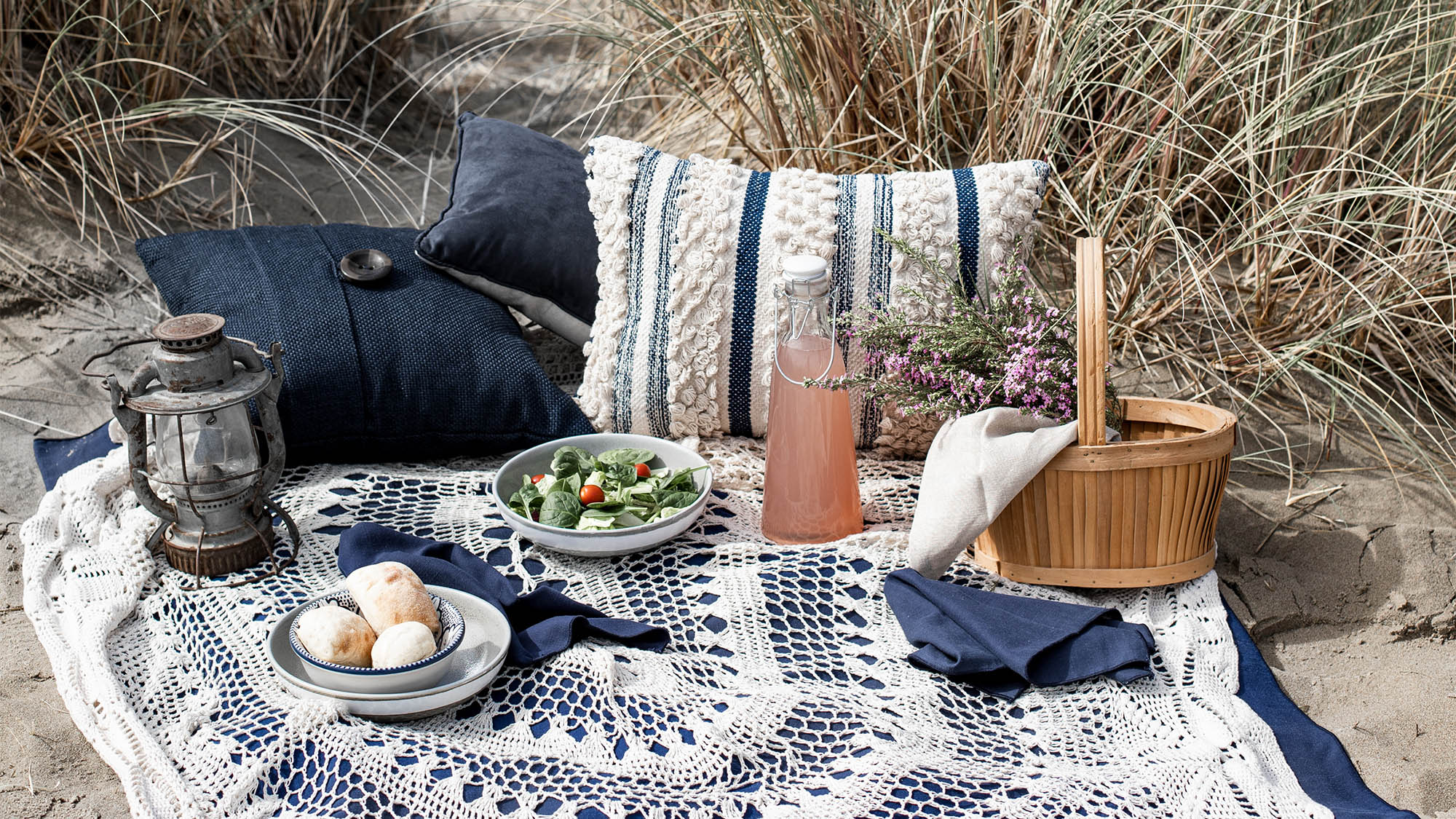 Picnic Food and Drink on Blanket at Beach