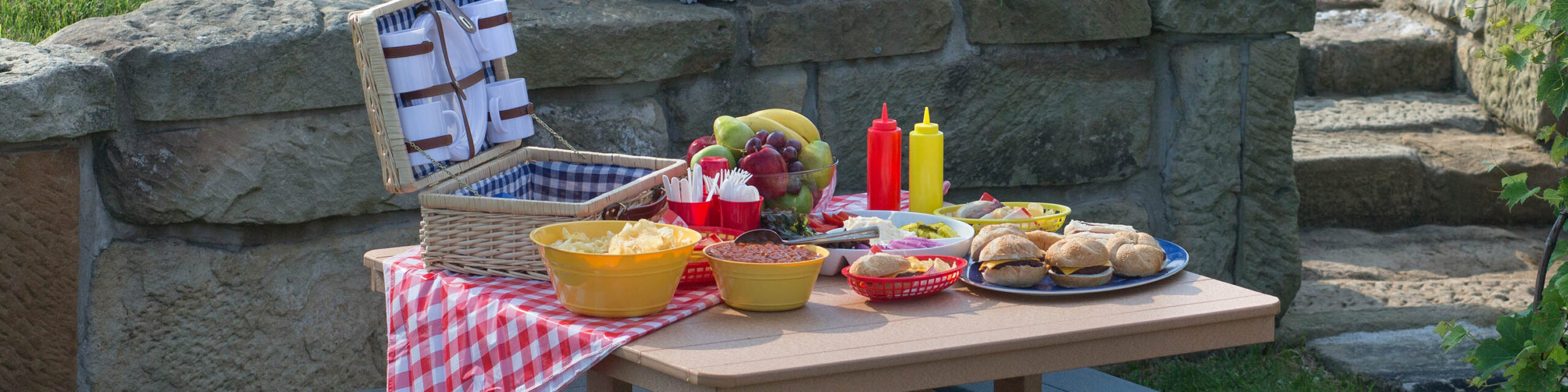 Picnic Basket and Food Items Scattered on Table