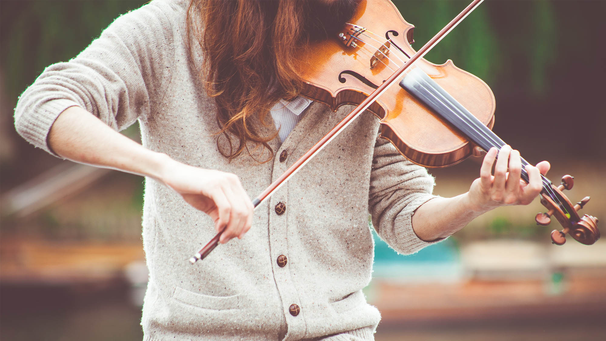 Closeup Neck Down Woman's Arms Playing Violin 