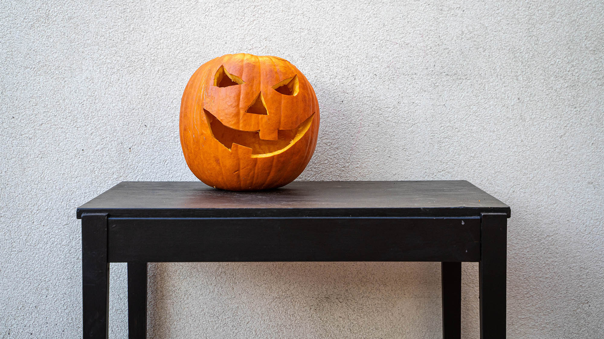 Jack-o-Lantern on Brown Wood Table