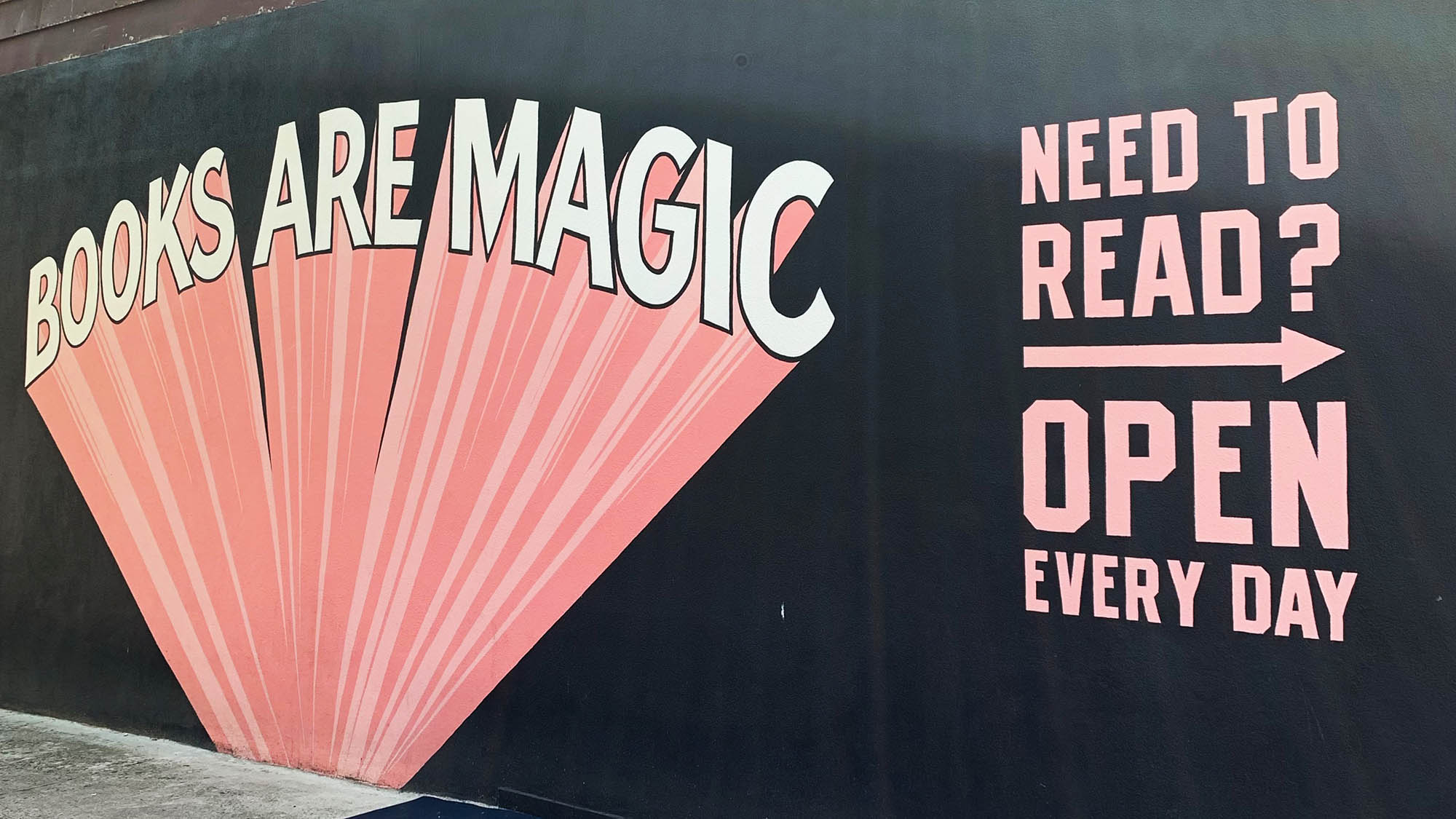 Books Are Magic mural on outside wall of Brooklyn bookstore