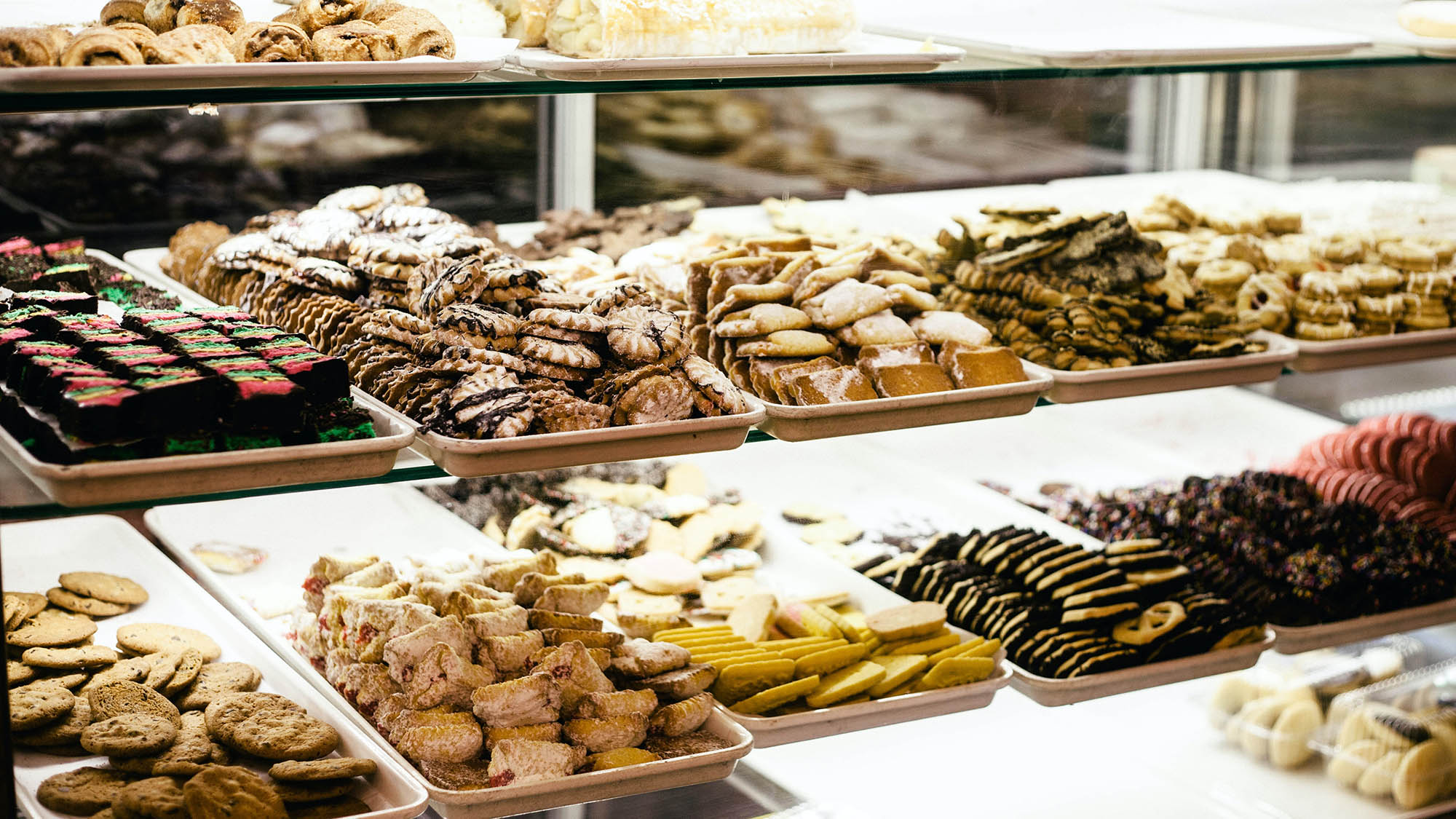 Assorted bakery cookies on shelves 