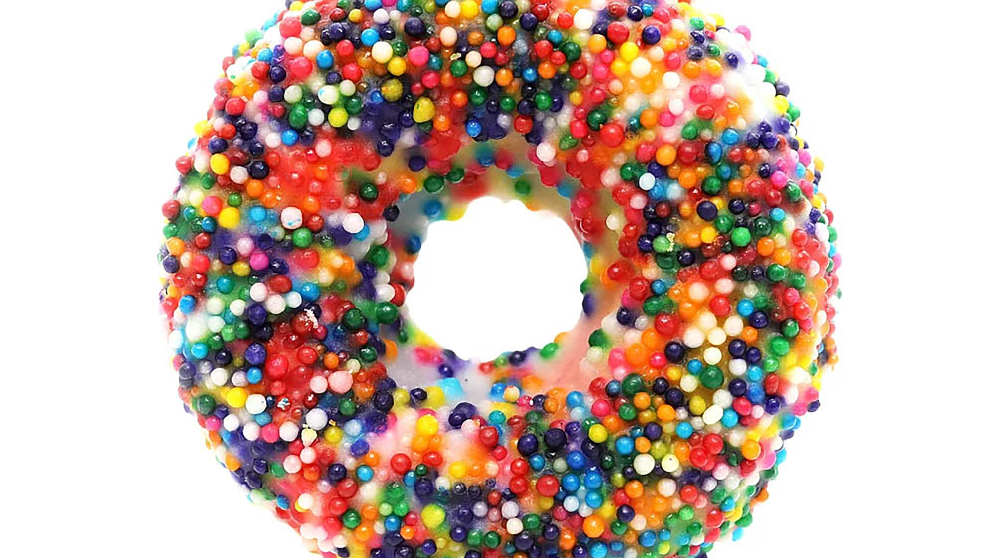 Donut with round rainbow sprinkles and white glaze