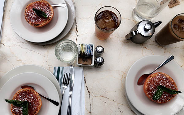 Grapefruit brulee on dining table with glasses