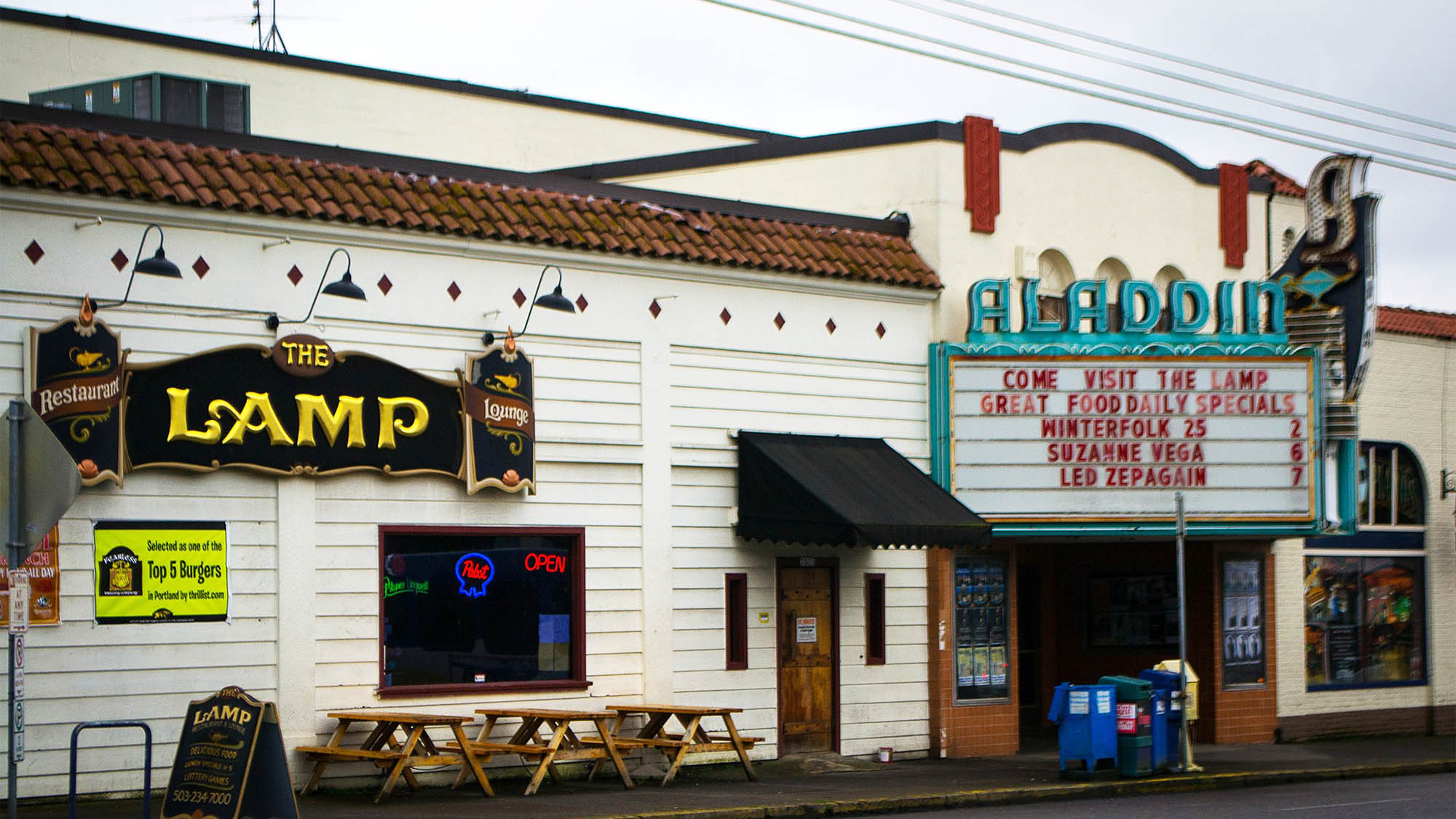 Historic Aladdin theater marquee and nextdor Lamp restaurant exterior 