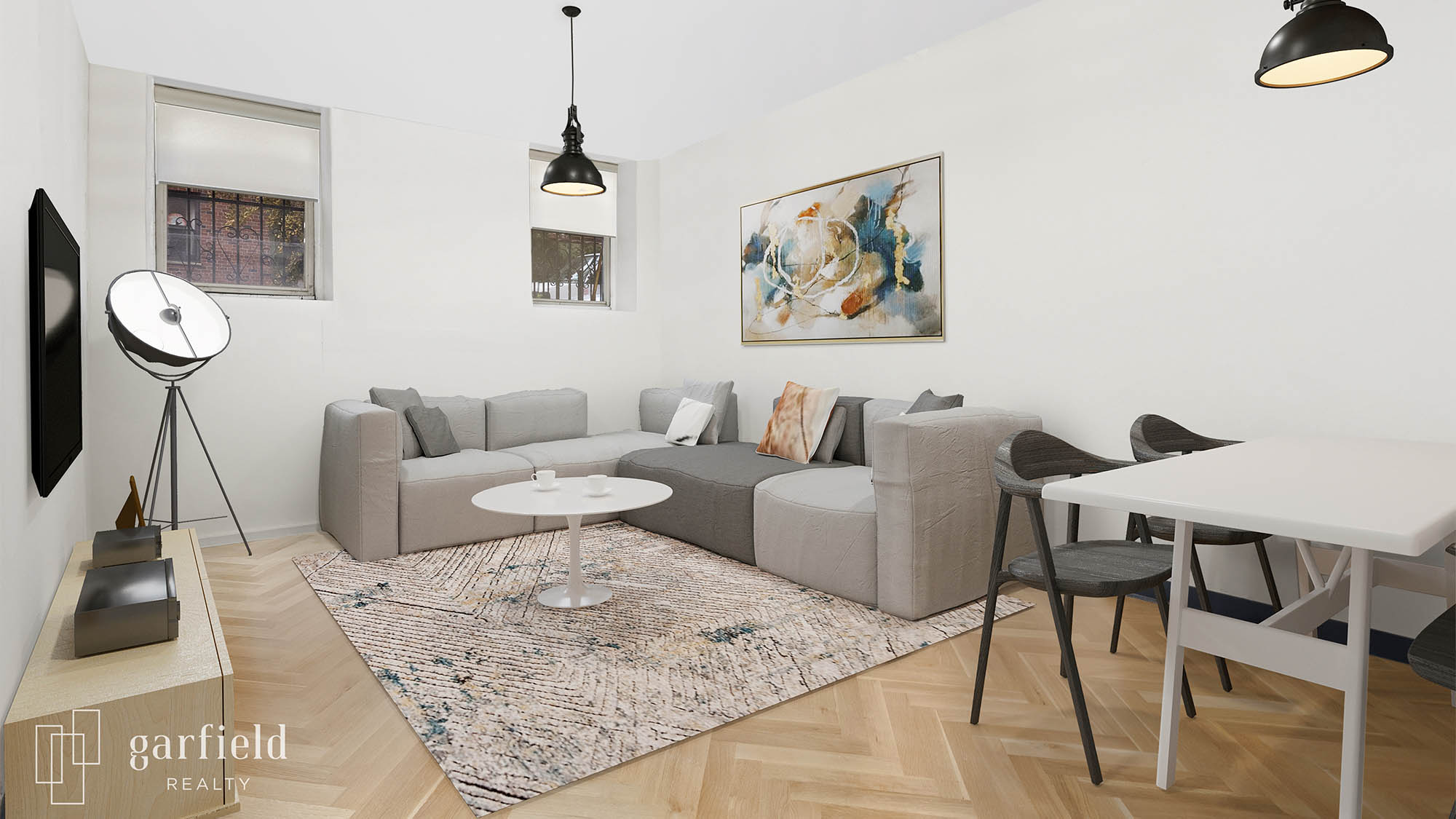 Virtual staged living room with grey corner sectional and white round table on throw rug and abstract painting on wall