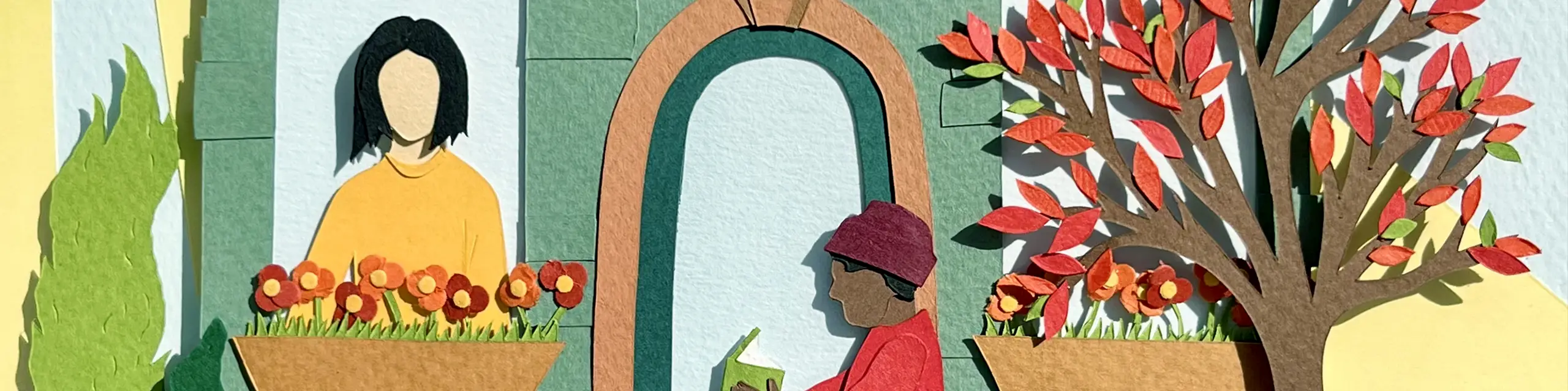 Paper cut-out of two people on brownstone stoop