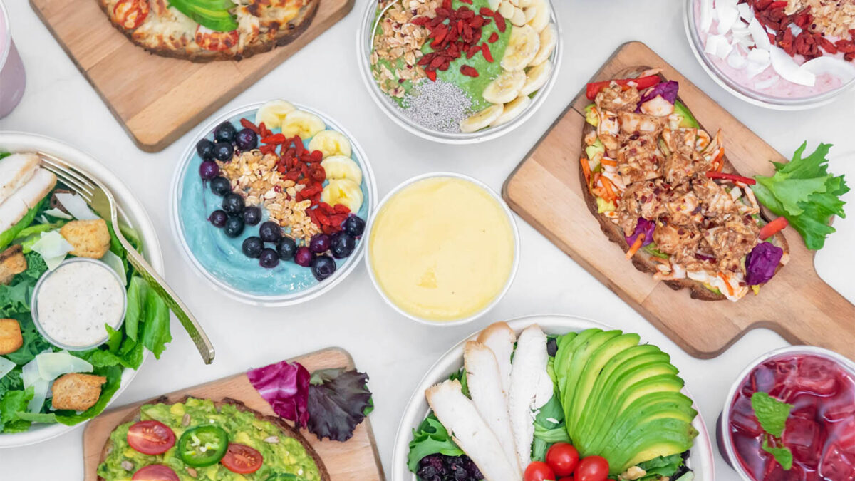 Variety of healthy salads, smoothie bowls and meals shot from above 