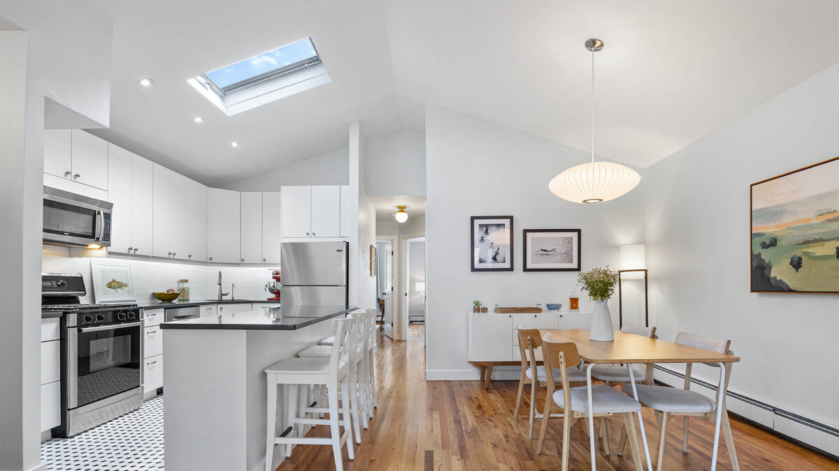 Left kitchen with skylight and right dining room modern design