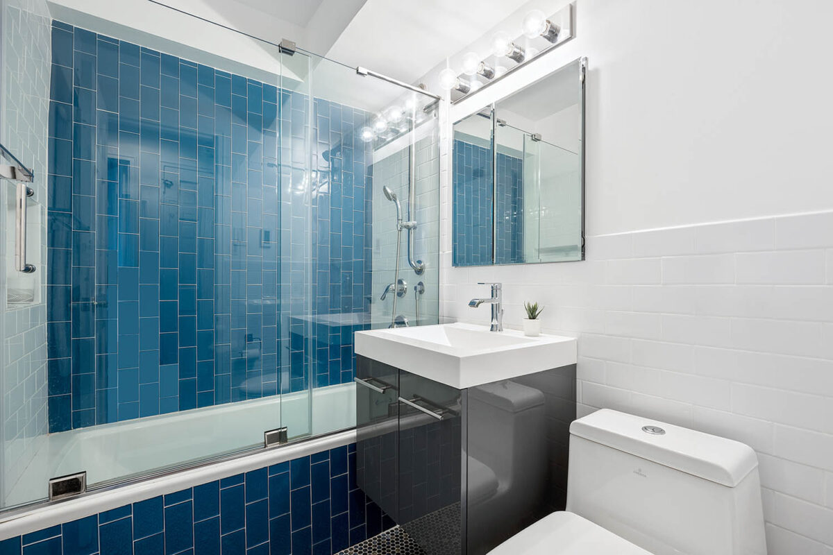 Modern bathroom with blue tile tub