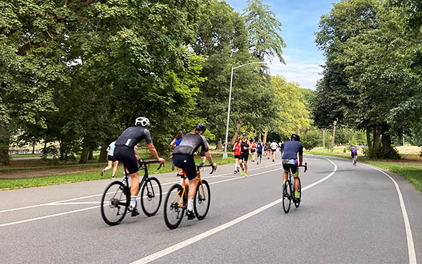 Cyclists riding Prospect Park trail