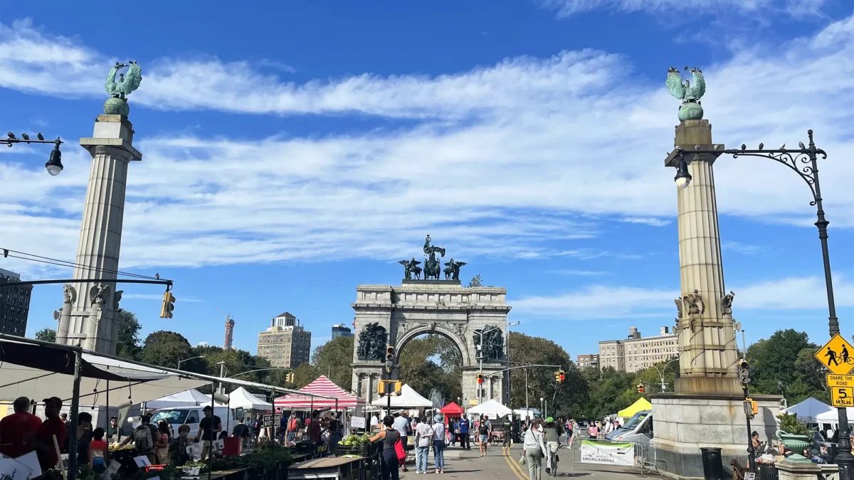 Grand Army Plaza Brooklyn farmers market with tents and people walking