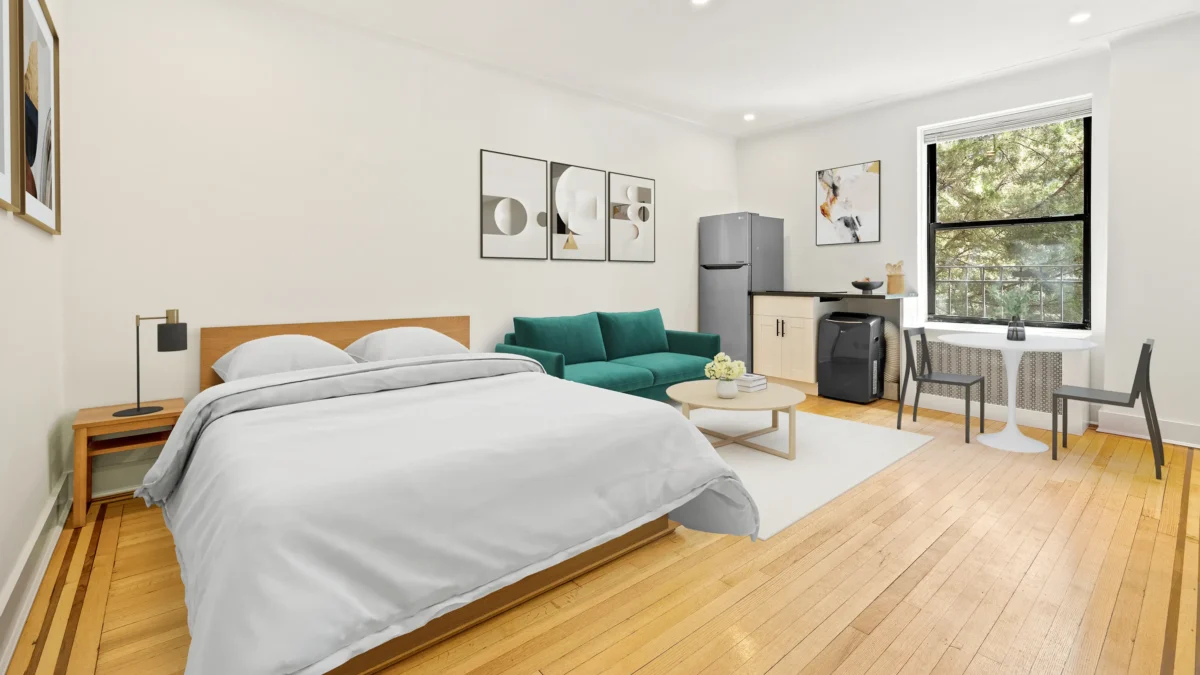 Apartment studio with bed, couch, table and compact wall kitchen