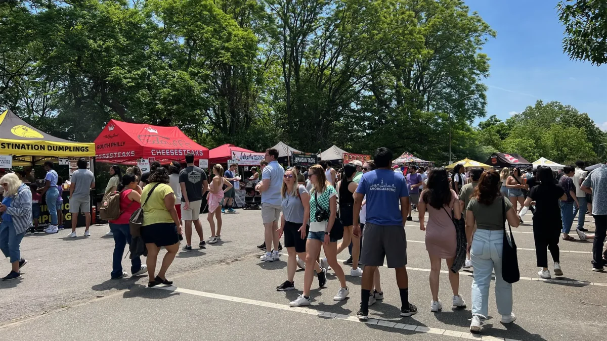 People gathering under tents at Greenmarket