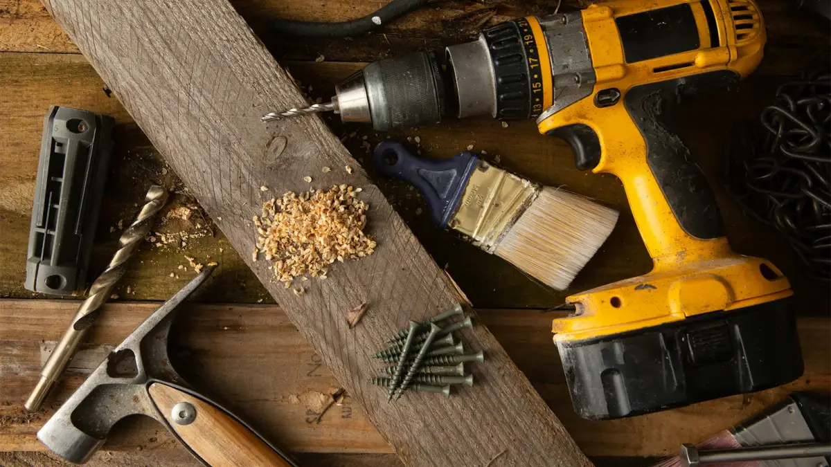 Screwdriver, hammer and wood