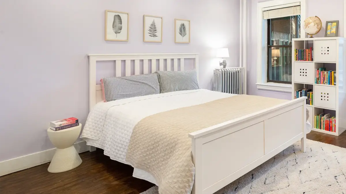 Cube bookshelf to right of bed