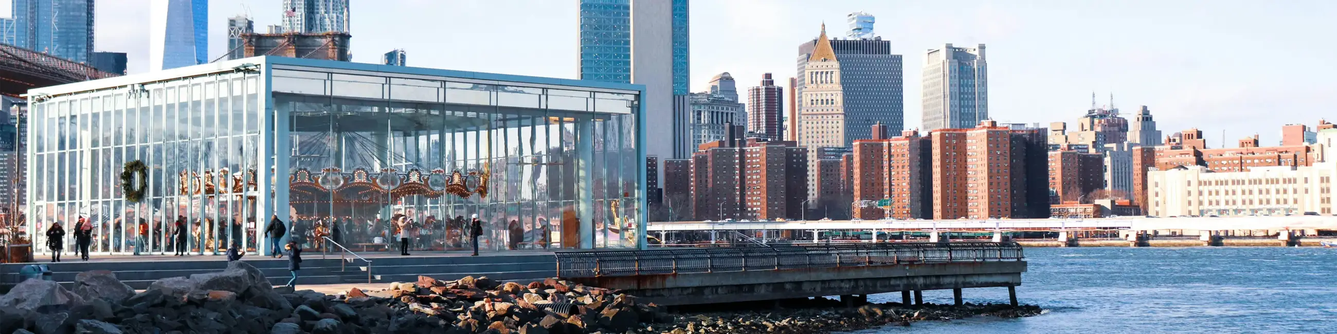 Jane's Carousel and Brooklyn Bridge Park overlooking NYC skyline